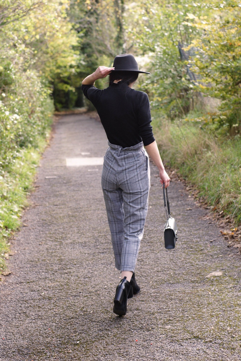 Brunette on Demand Wearing High Waisted Cigarette Trousers With Style