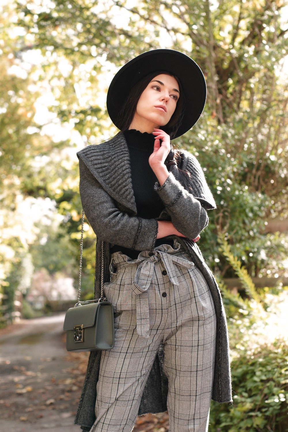 Brunette on Demand Wearing Checked Pattern Trousers With Style