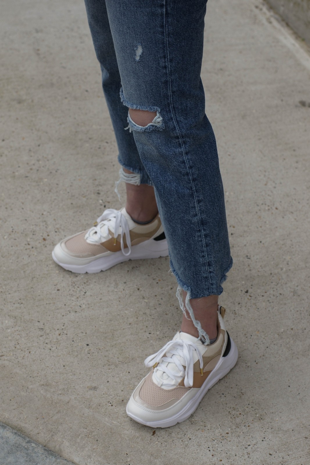 Ripped Jeans And Trainers