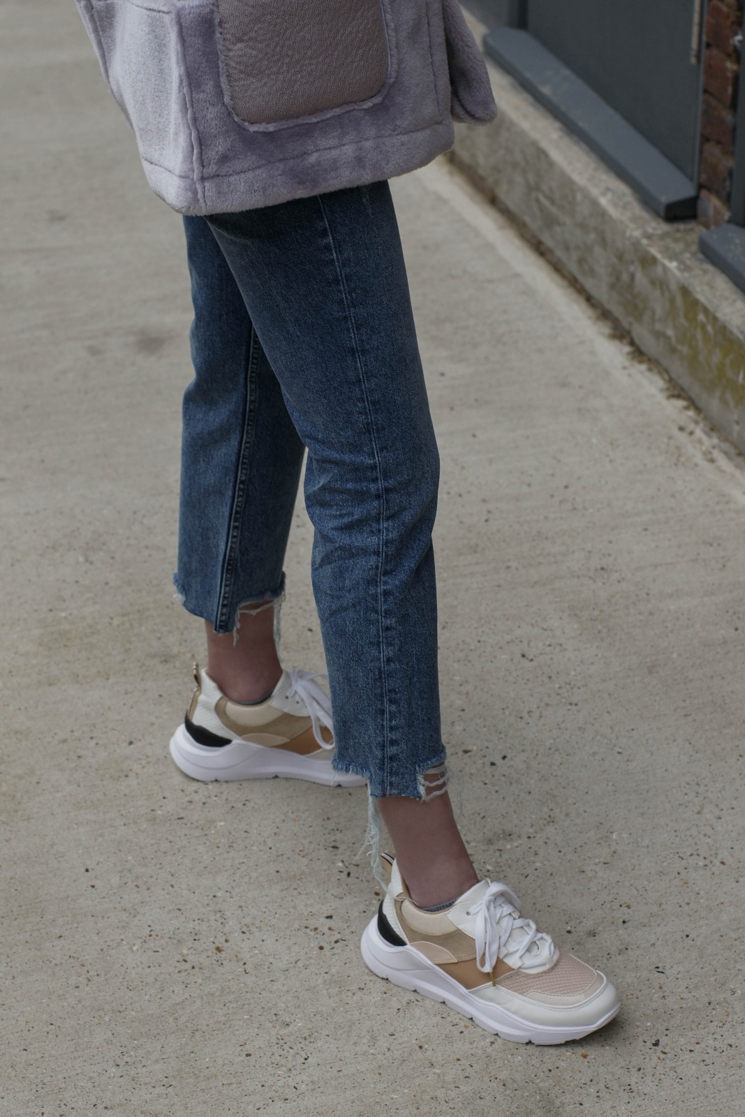 Flared jeans with colourful chunky trainers