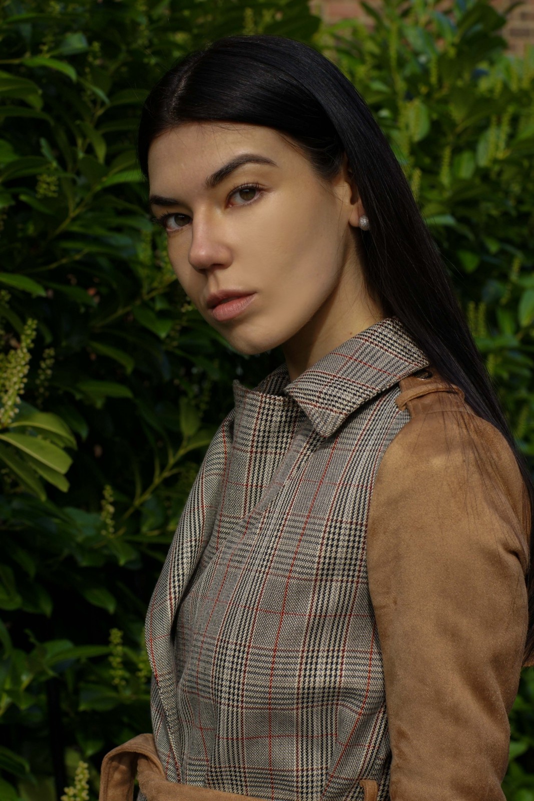 Brunette girl wearing trench coat