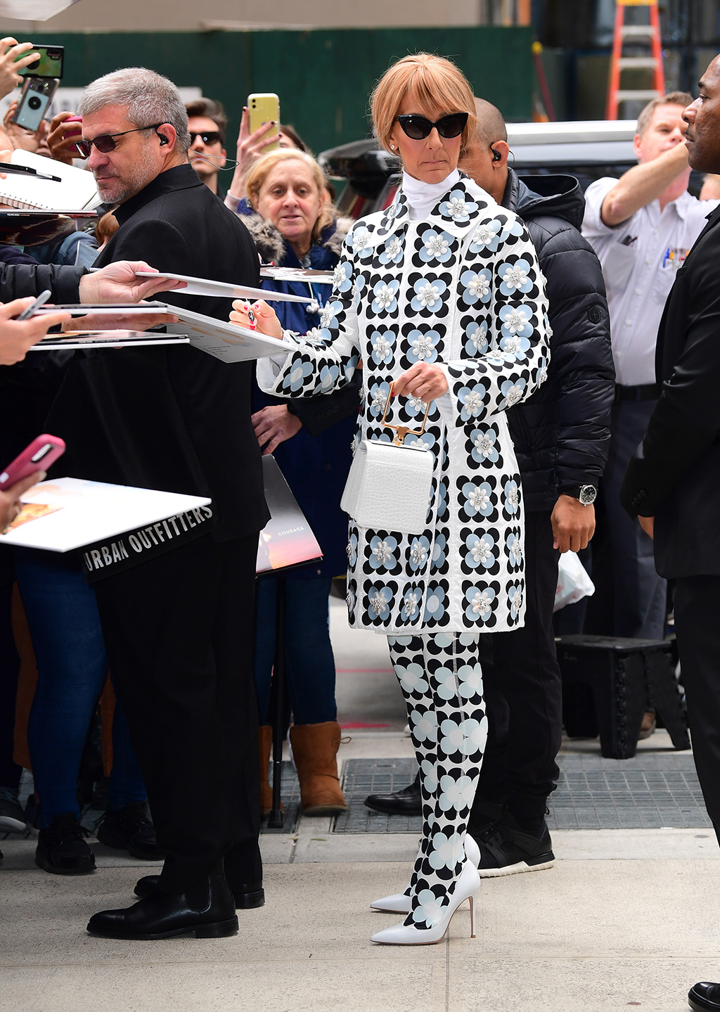 Celine Dion with white Marge Sherwood tote in NYC